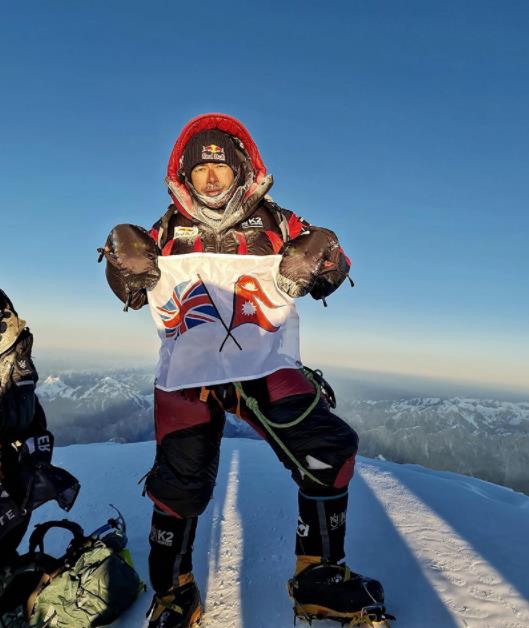 Nirmal “Nims” Purja on the summit of K2 having climbed without supplementary oxygen. Photo: Geljen Sherpa   